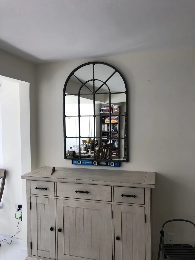 Mirror above a cabinet